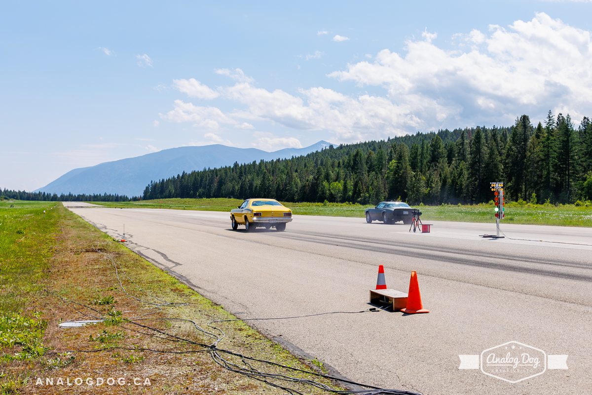 Two entrants racing down the track at the 2023 Airport Drag Races